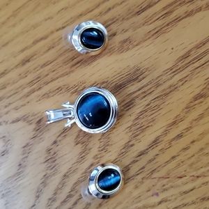 Blue pendant with matching pierced earrings.  Pendant is 1 3/4 x 3/4. Silver.